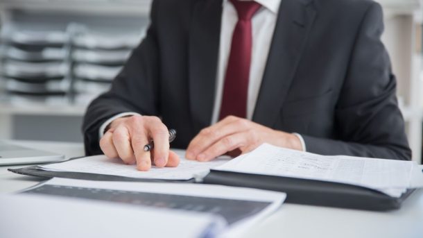 Financial adviser discussing debt solutions with a client seeking the best debt counsellor